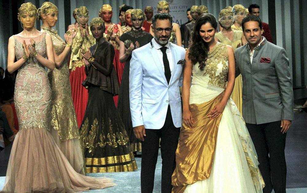 Tennis player Sania Mirza dispays a collection with Designer Shantanu & Nikhil during the fourth day of India Bridal Fashion Week in Mumbai.