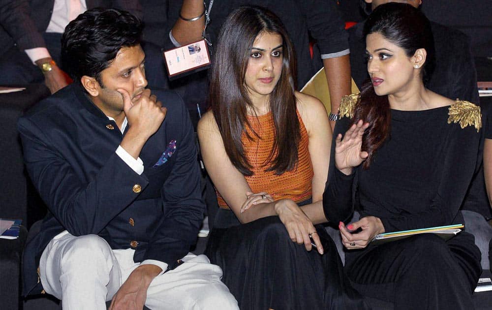 Bollywood actor Riteish Deshmukh with his wife actor Genelia and actress Shamita Shetty during the fourth day of India Bridal Fashion Week in Mumbai.