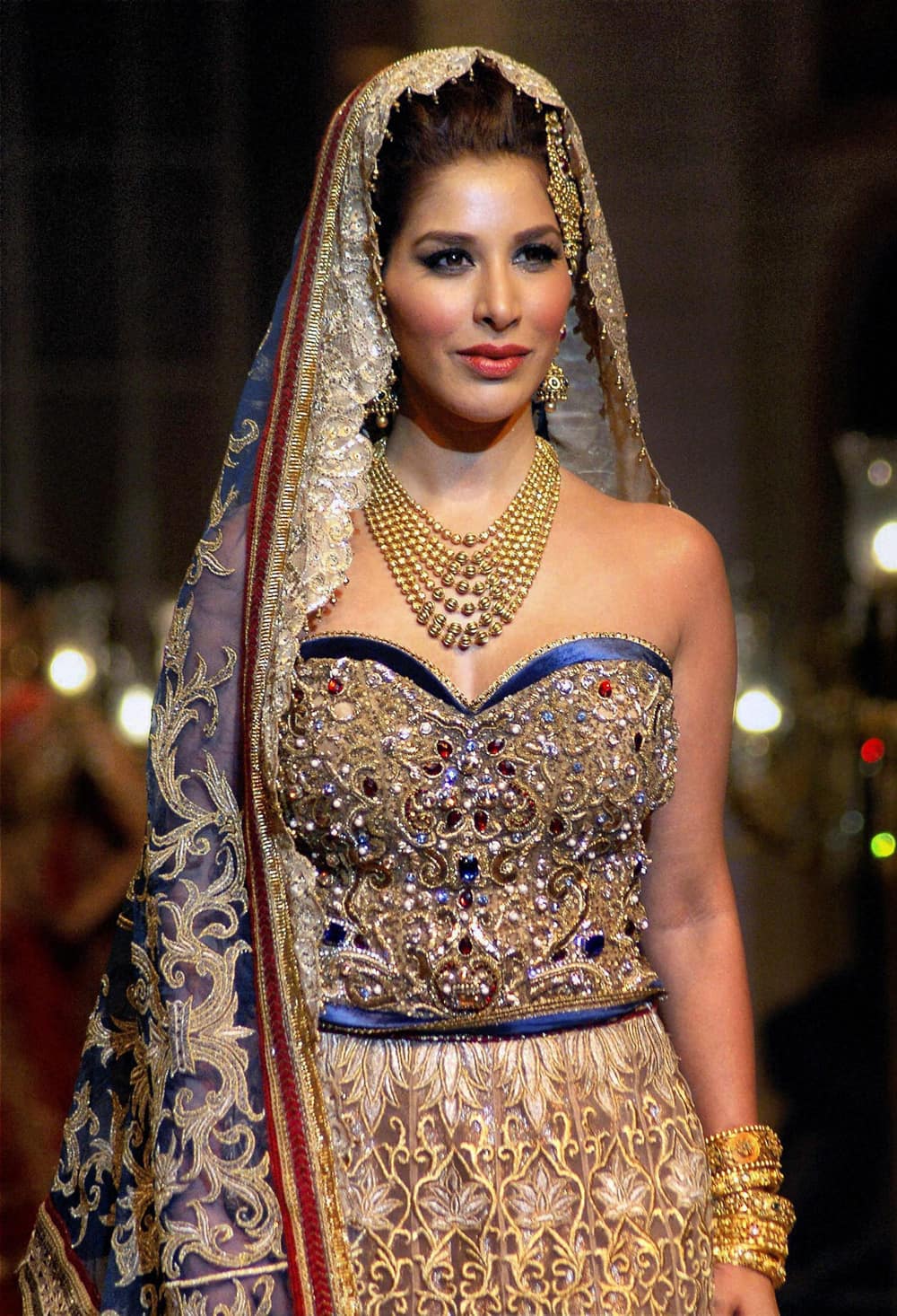 Bollywood actress Sophie Choudry walks the ramp at the India Bridal Fashion Week in Mumbai.