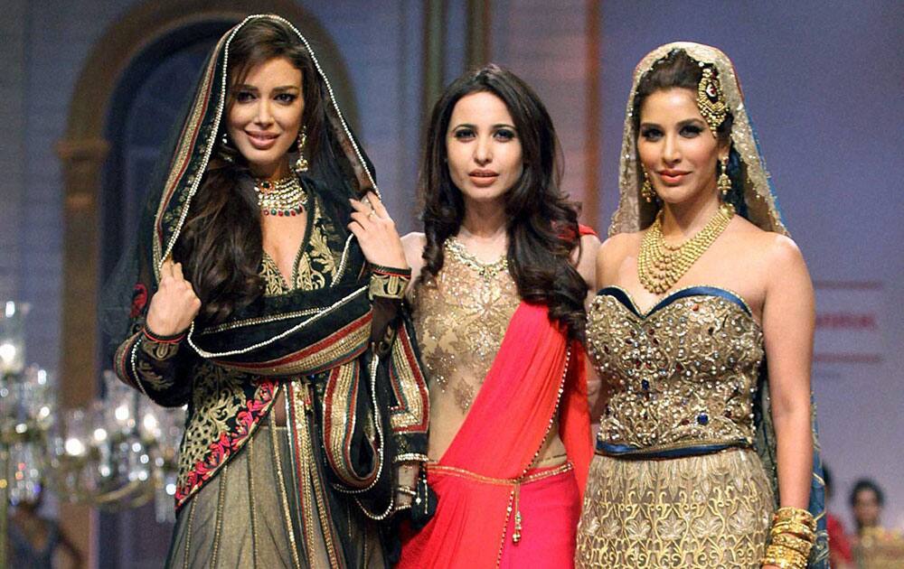 Fashion designer Mandira Wirk with actors Sahar Biniaz & Sophie Choudry at India Bridal Fashion Week 2013 in Mumbai.