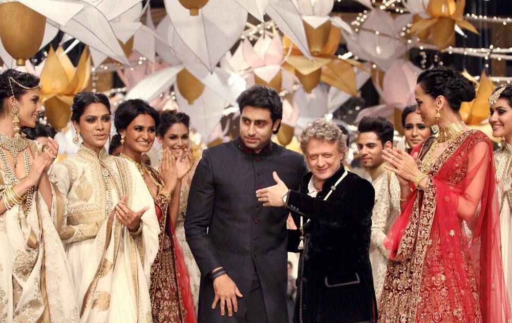 Abhishek Bachchan along with models walks the ramp for designer Rohit Bal during grand finale of India Bridal Fashion Week in Mumbai.