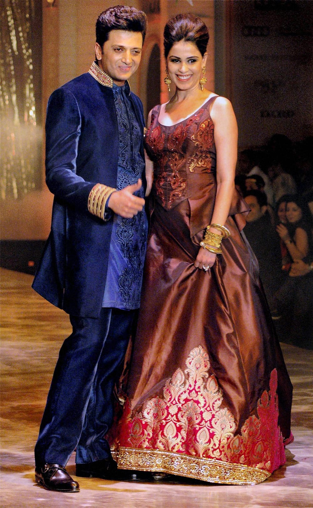 Ritesh Deshmukh and Genelia walk the ramp for designer Neeta Lulla during grand finale of India Bridal Fashion Week in Mumbai.