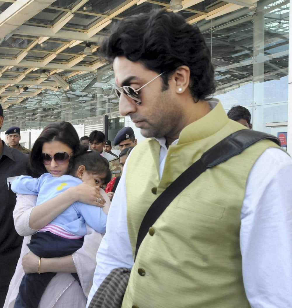 Abhishek Bachchan and Aishwarya with their daughter Aradhya arrive in Bhopal to attend a marriage function.