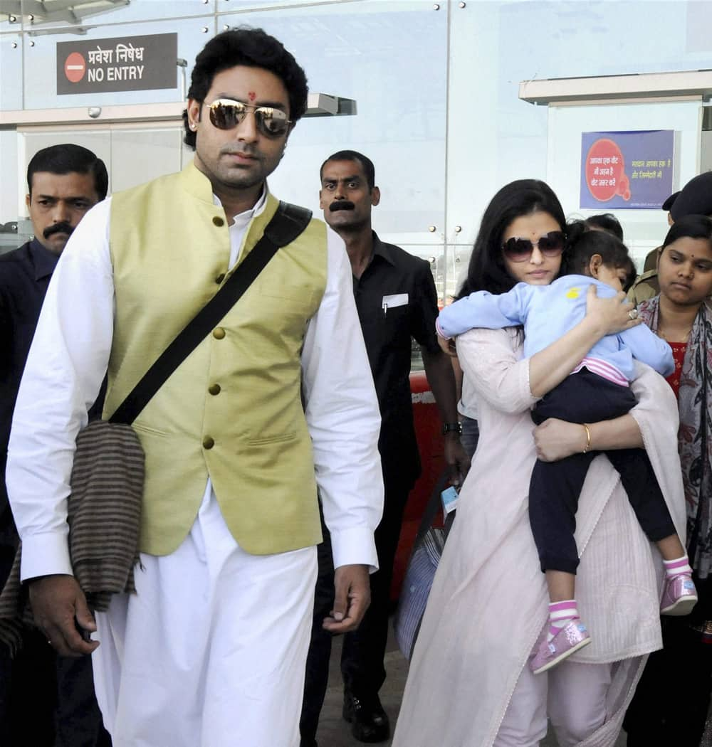 Abhishek Bachchan and Aishwarya with their daughter Aradhya arrive in Bhopal to attend a marriage function.