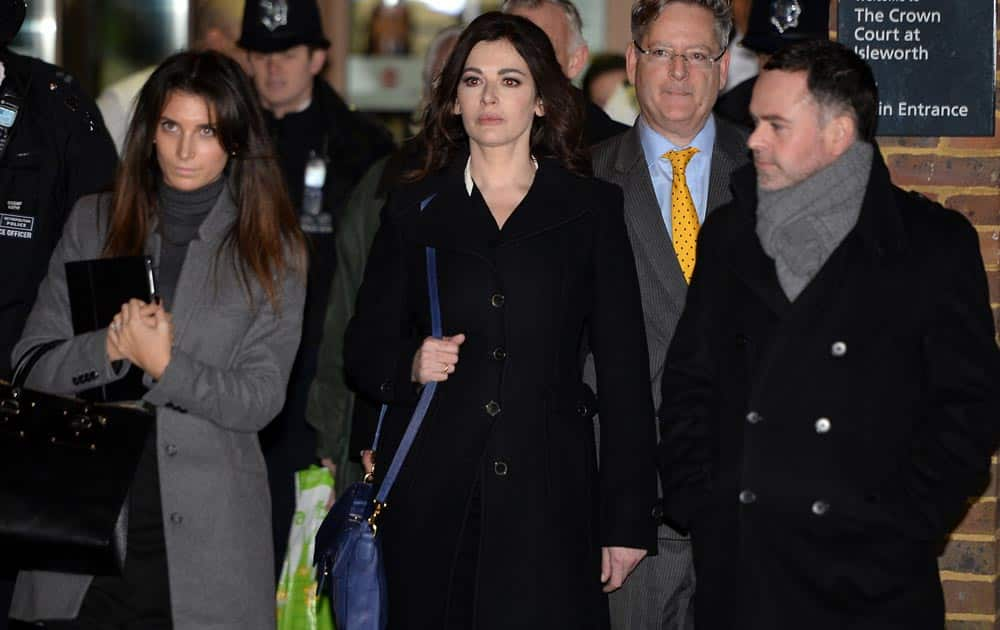 Celebrity chef, Nigella Lawson, center, leaves Isleworth Crown Court in London.