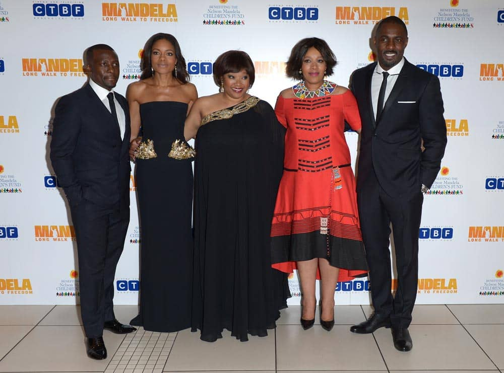 Tony Kgoroge, Naomie Harris, Zindzi Mandela, her sister Zenani, and Idris Elba pose for photographers at the UK Premiere of 'Mandela: Long Walk To Freedom' at the Odeon Leicester Square in London.