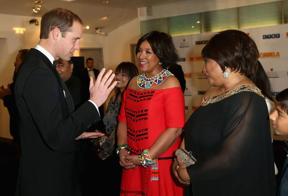 Britain's Prince William, Duke of Cambridge, meets Zindzi Mandela, right, the daughter of former South African President, Nelson Mandela, as they attend the Royal Film Performance of Mandela: Long Walk to Freedom, at the Odeon Leicester Square, London.