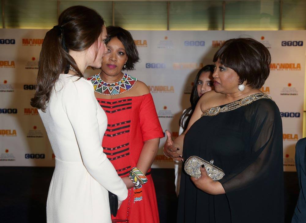 Kate, Duchess of Cambridge, left, meets Zindzi Mandela, right, the daughter of former South African President, Nelson Mandela, as they attend the Royal Film Performance of Mandela: Long Walk to Freedom, at the Odeon Leicester Square, London.