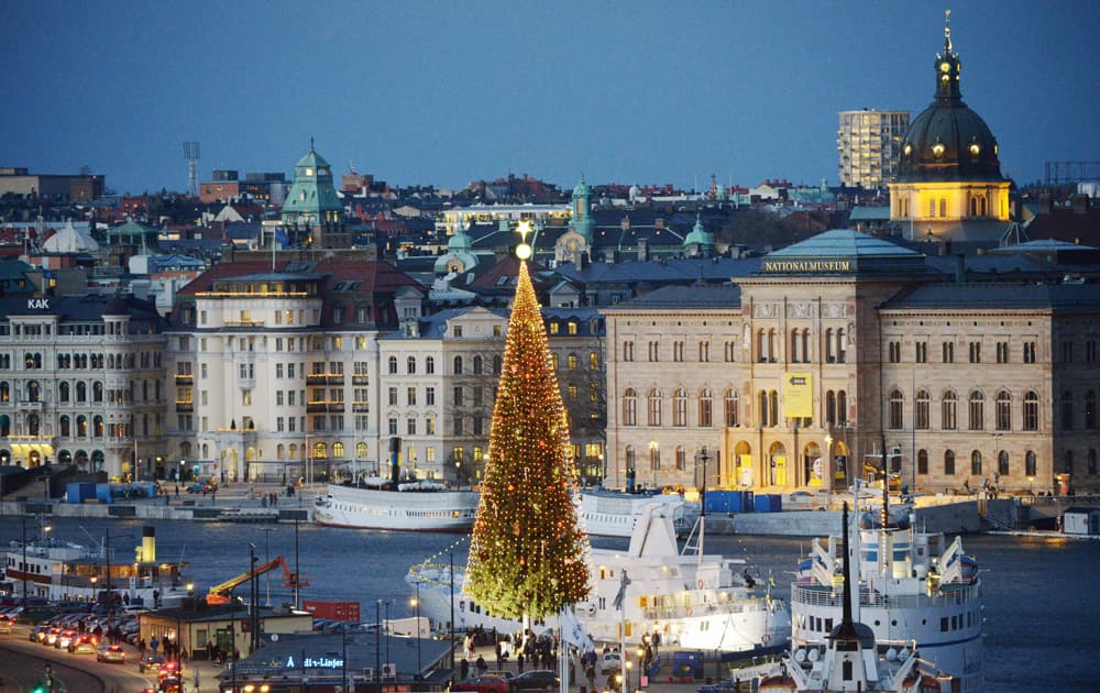 A 36-metre tall traditional Christmas tree is lit up on the first Sunday of Advent at Skeppsbron in central Stockholm.