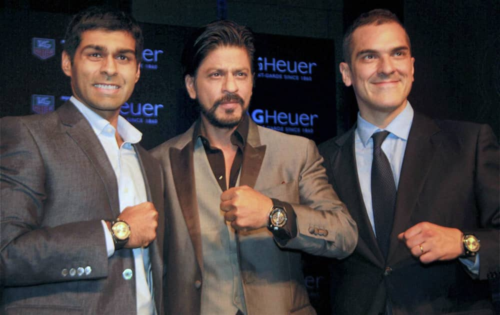 TAG Heuer Brand Ambassador & Bollywood actor Shahrukh Khan with F1 driver Karun Chandhok and General Manager, TAG Heuer India Franck Dardenne to launch the TAG Heuer's new Carrera Calibre 1887 Chronograph watch in Gurgaon.