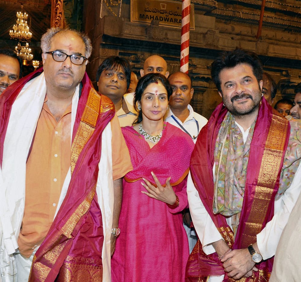 Sridevi with her husband Boney Kapoor and actor Anil Kapoor coming out of Lord Venkateswara temple after offering prayers at Tirumala in Tirupati.