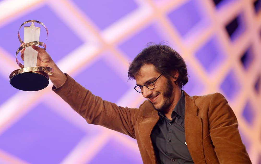 Cuban Machado Quintela poses for photographers with his Jury Prize award for his film 