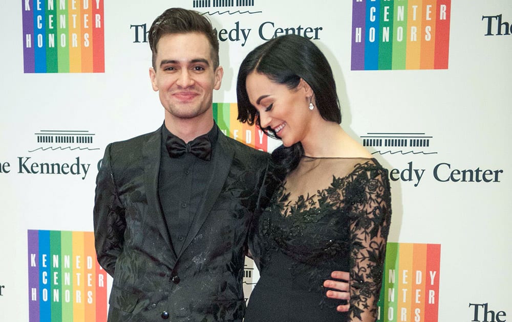 Brendon Urie and his wife, Sarah, arrive at the State Department for the Kennedy Center Honors gala dinner in Washington. 