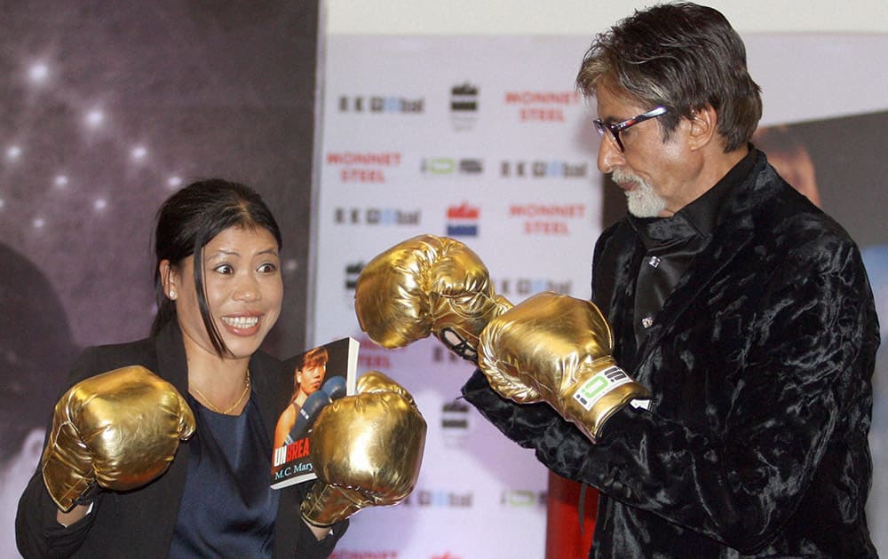 Olympic Champion boxer Mary Kom and superstar Amitabh Bachchan during the launch of her autobiography 'Unbreakable' in Mumbai.