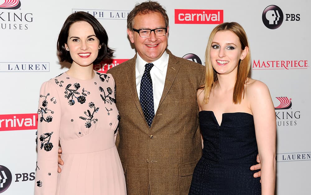 Actors Michelle Dockery, left, Hugh Bonneville and Laura Carmichael attend the `Downton Abbey` cast photo call at the Millennium Hotel in New York.