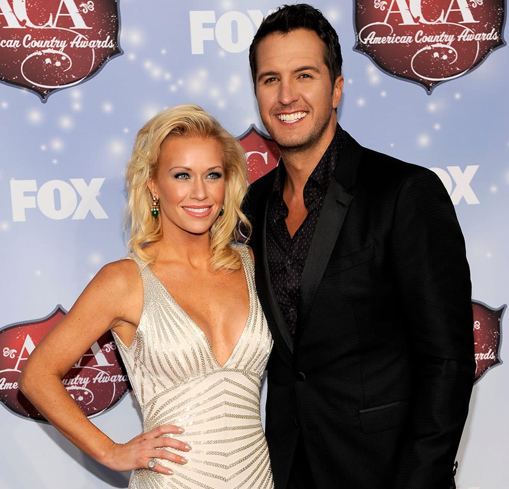 Luke Bryan, right, and Caroline Bryan arrive at the American Country Awards at the Mandalay Bay Resort & Casino in Las Vegas, Nev.