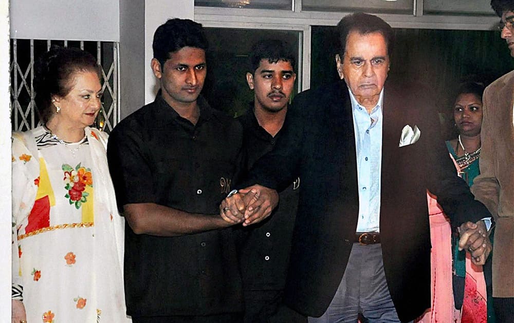 Legendary actor Dilip Kumar, along with his wife Saira Banu, comes out of his residence on his 91st birthday, in Mumbai.