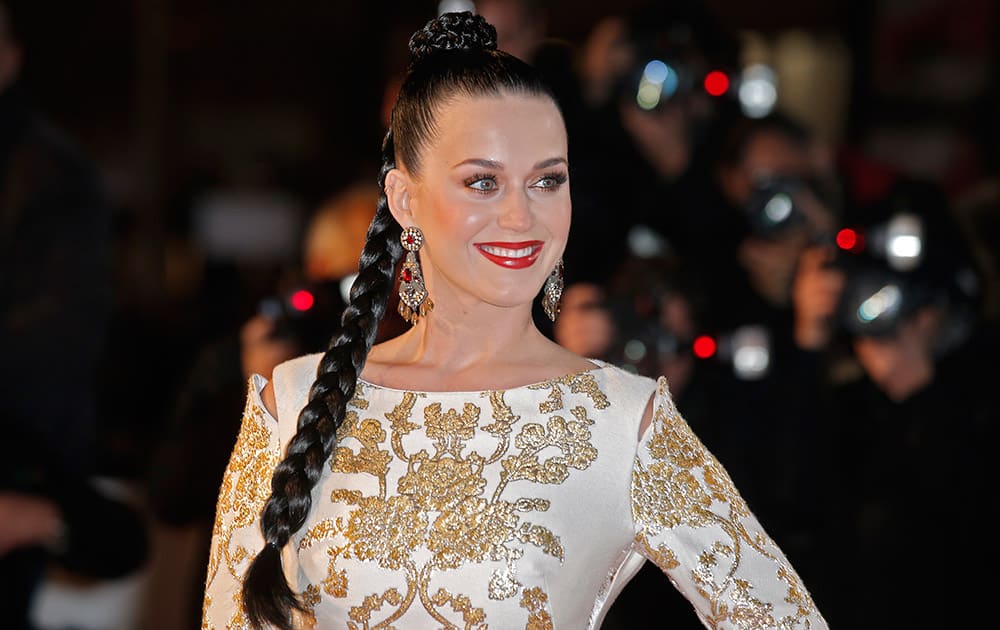 Katy Perry arrives at the Cannes festival palace, to take part in the NRJ Music awards ceremony, in Cannes, southeastern France.