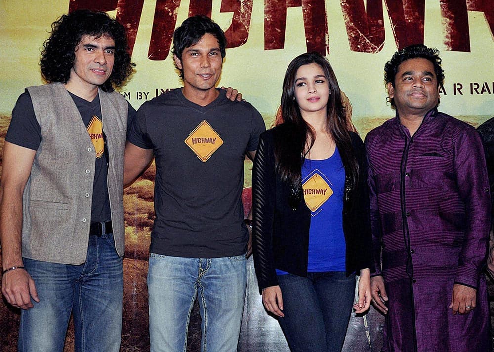 Bollywood director Imtiaz Ali with actors Randeep Hooda, Alia Bhatt and music composer A R Rahman during the launch of first look of the film Highway in Mumbai.