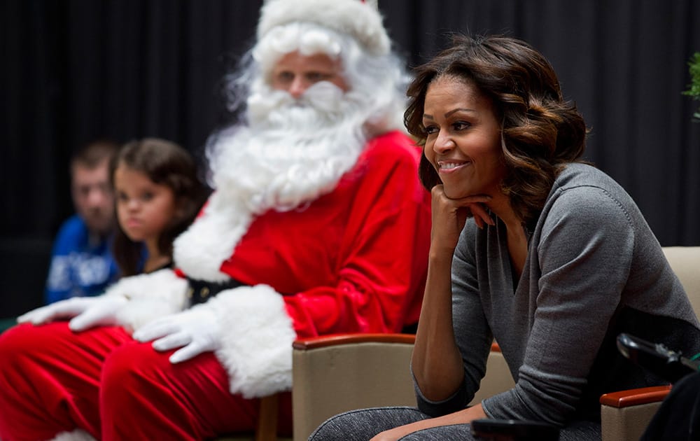 First lady Michelle Obama listens to questions from children after reading them a holiday story at Children's National Health System in Washington.