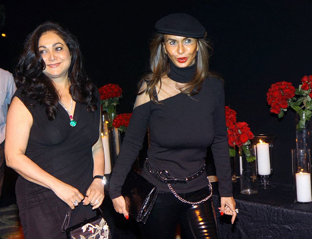  Philanthropist Tina Ambani (L) and socialite Parmeshwar Godrej arrive to attend a party hosted by actress Deepika Padukone in Mumbai.