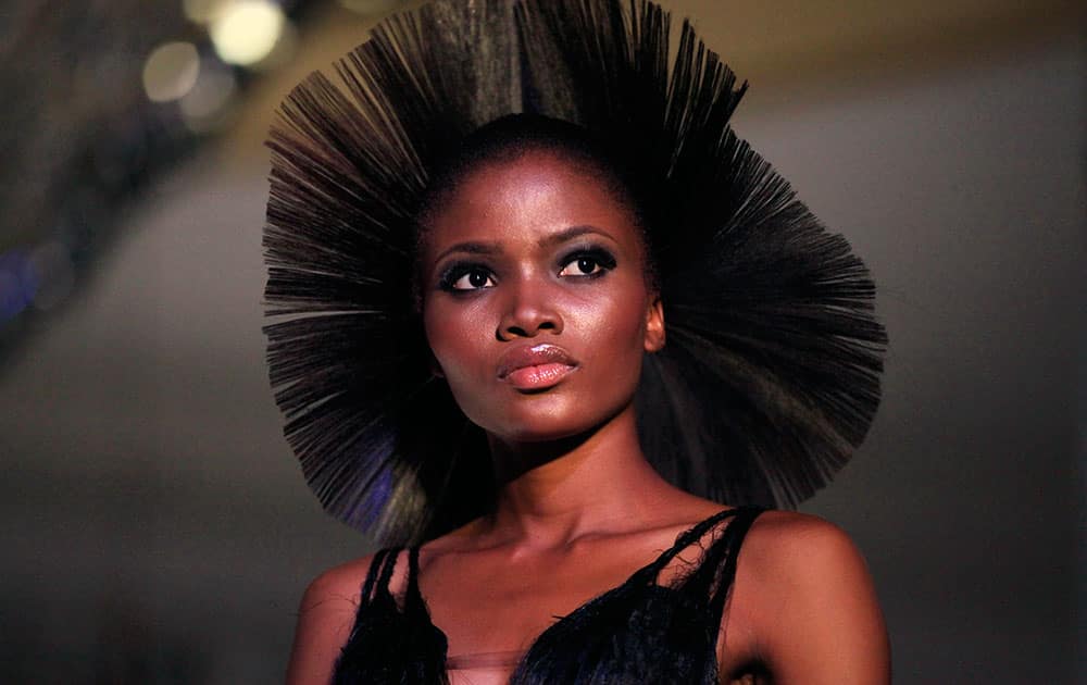 An ISIS model displays an outfit by designer Deola Sagoe during the Music Meets Runway fashion show in Lagos, Nigeria.