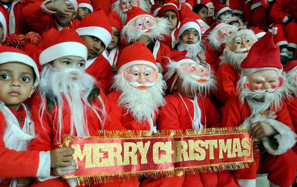 Children of a school dressed up as Santa Claus to celebrate Christmas in Moradabad.