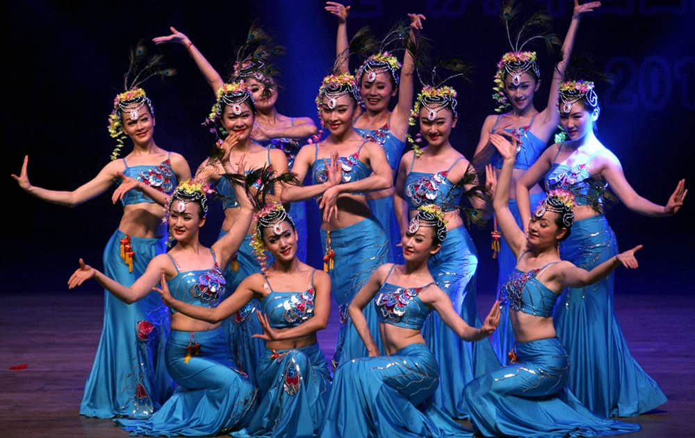 Chinese artists perform during an event in connection with Christmas and New Year celebrations in Kolkata.