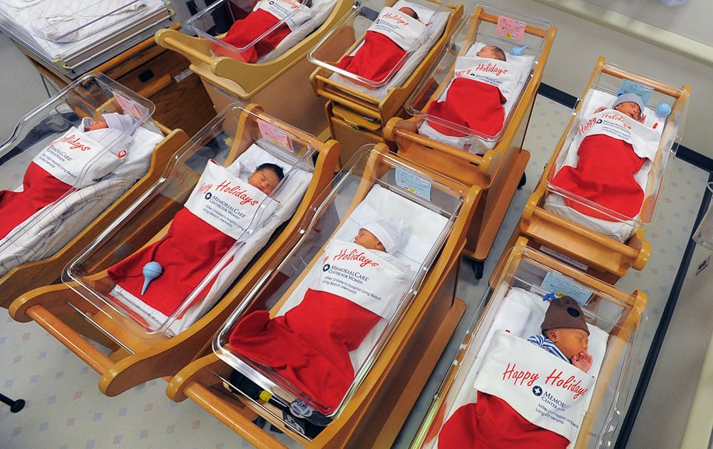 Newborns sleep in oversized red stockings in the nursery at Long Beach Memorial in Long Beach, Calif. For more than 50 years, babies born between Dec. 21-25 at Long Beach Memorial are placed in big red stockings to be presented to the new parents.