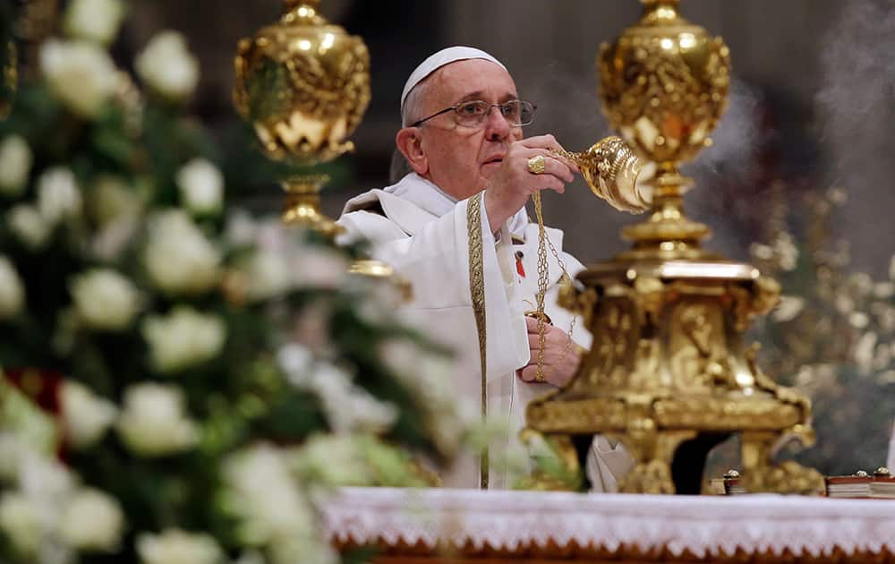 Pope Francis celebrates the Christmas Eve Mass in St. Peter's Basilica at the Vatican.