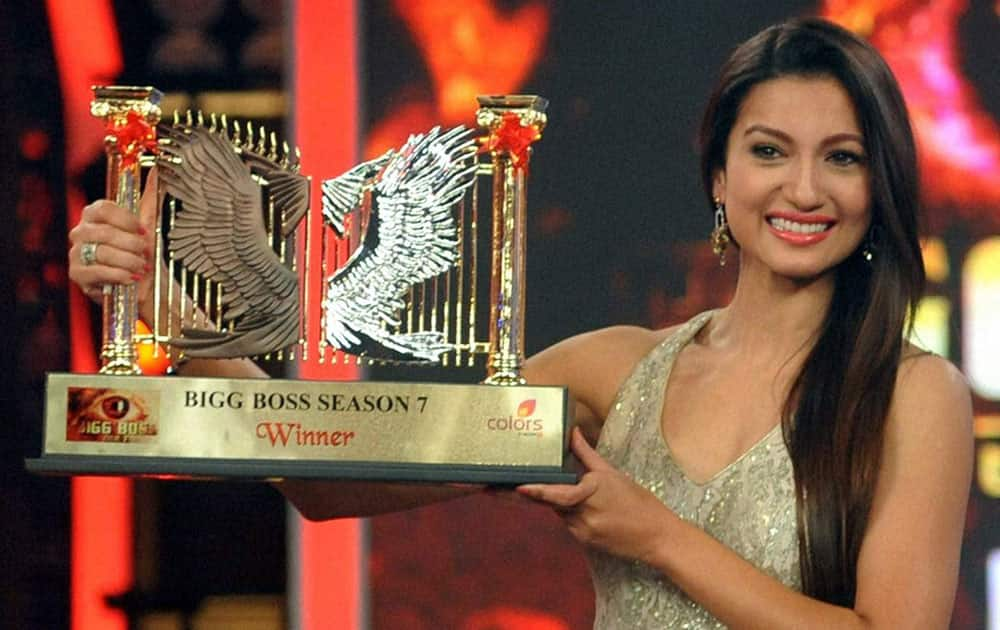 Big Boss season 7 winner Gauhar Khan displays award during the grand finale at Lonavala.