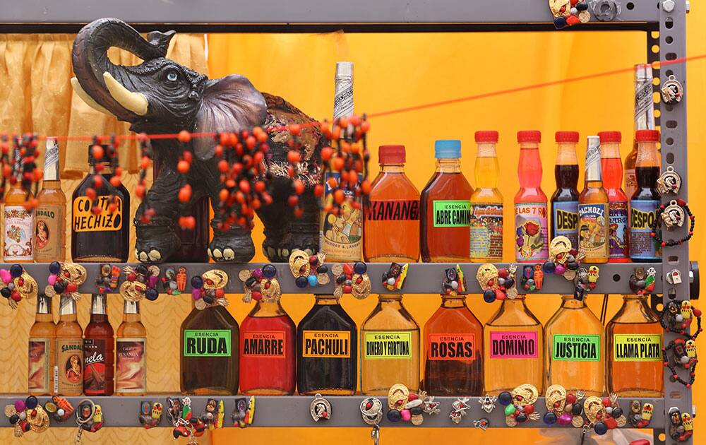 Jessy the shaman has different potions for a New Year's ritual to bring good luck to her clients as seen in her stall at the Market of Wishes in Lima, Peru.