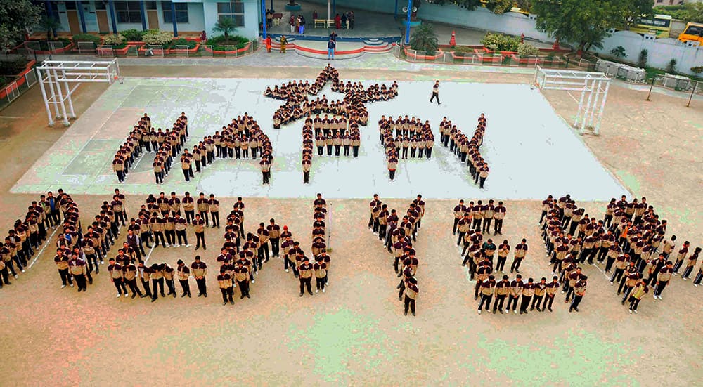 School children forming a human chain as part of their new year celebrations on the eve of the New Year in Allahabad.