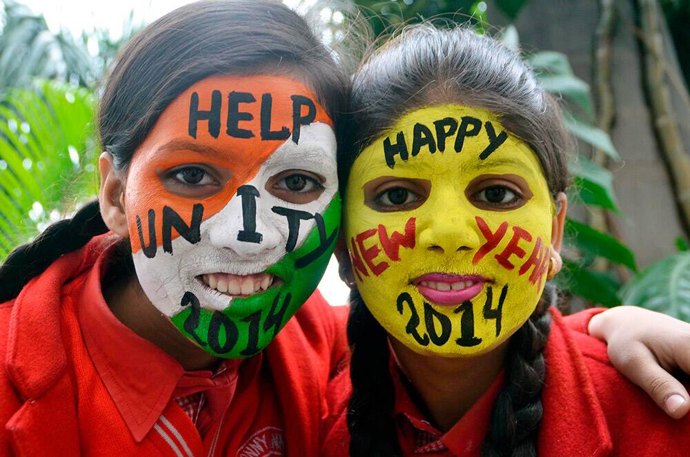 Girls painted their faces as part of their New Year celebrations on the eve of New Year in Moradabad.