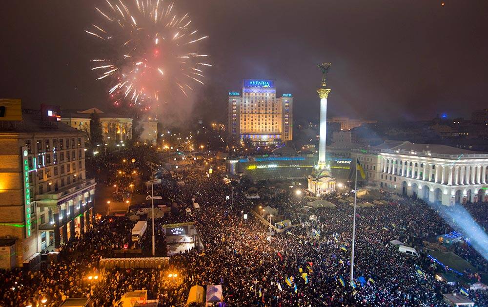 Fireworks explode as pro-European Union activists celebrate the New Year in the Ukrainian capital Kiev's main square.