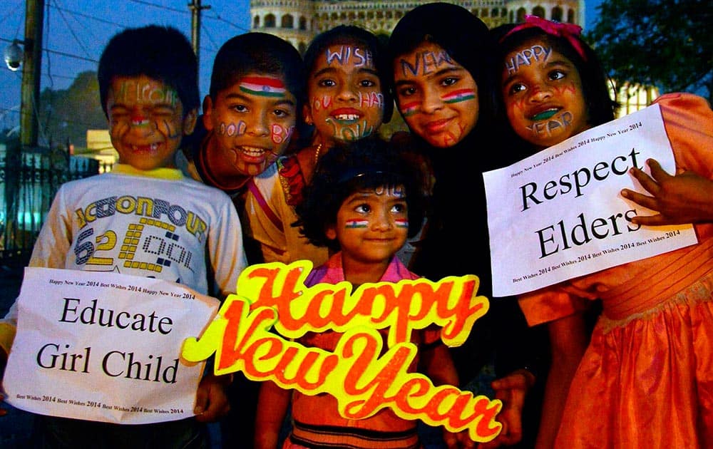 Students painted their faces as part of new year's celebration on the eve of New Year, near Charminar in old city of Hyderabad.