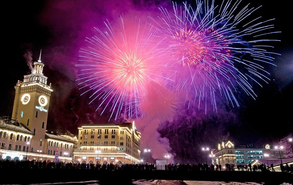 Fireworks explode above the central square of Rosa Khutor ski resort, a venue of the 2014 Winter Olympics, in Krasnaya Polyana, 60 kilometers east of Sochi, Russia during New Year's celebrations.