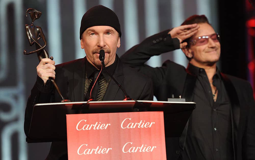 Bono, right, and The Edge, of musical group U2, accept the Sonny Bono Visionary Award at the Palm Springs International Film Festival Awards Gala at the Palm Springs Convention Center.