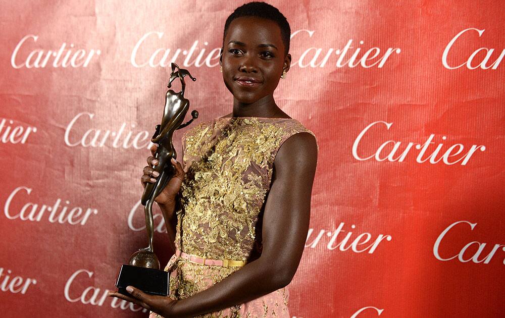 Lupita Nyong'o poses backstage at the Palm Springs International Film Festival Awards Gala at the Palm Springs Convention Center.