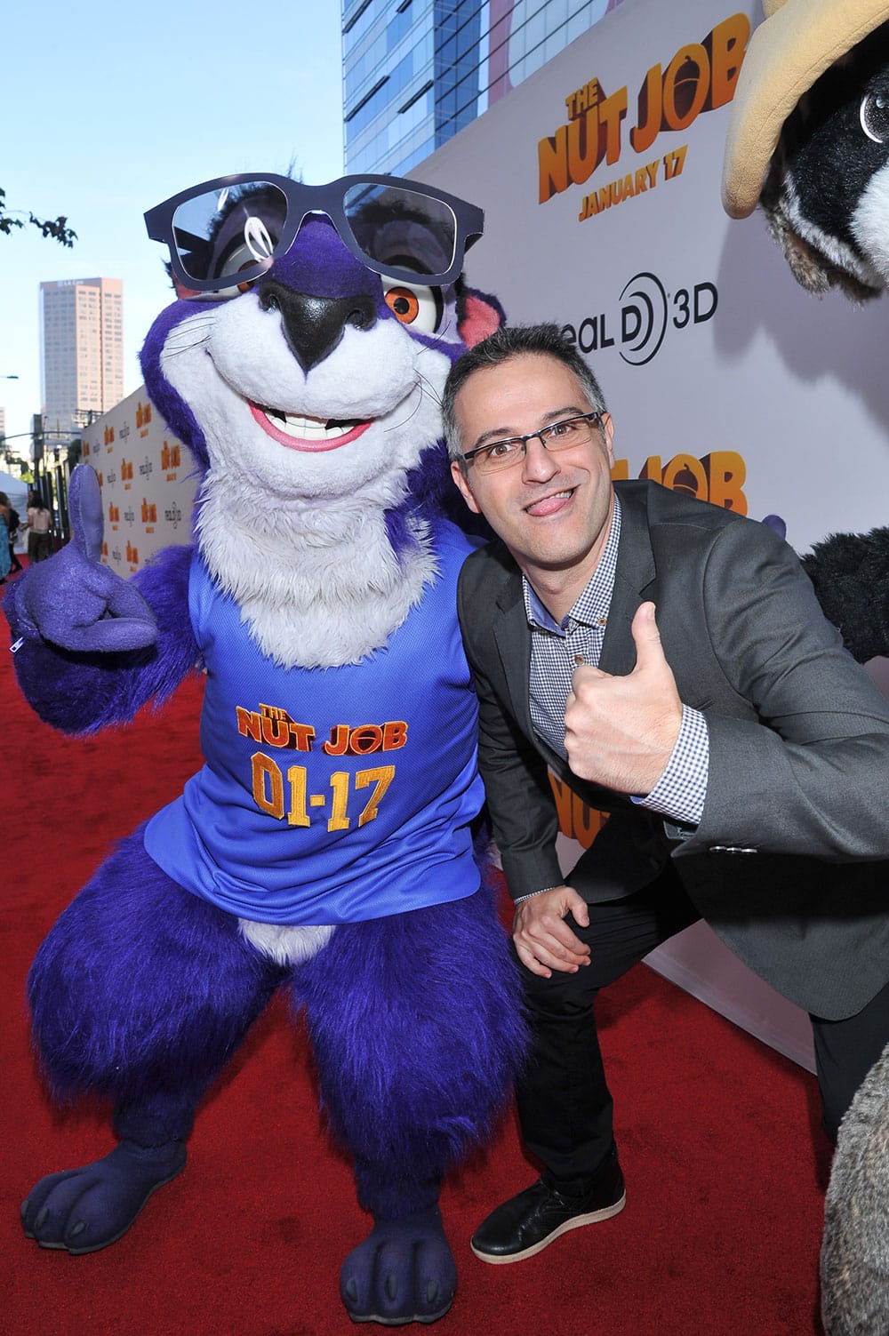 Surly the Squirrel and director Peter Lepeniotis are seen at the premiere of the animated film `The Nut Job` in Los Angeles.