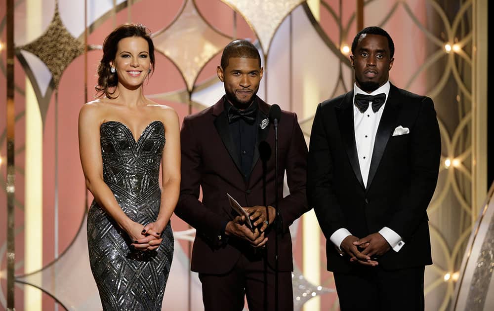 From left, Kate Beckinsale, Usher and Sean Diddy Combs during the 71st annual Golden Globe Awards.