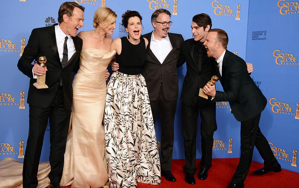 From left, Bryan Cranston, Anna Gunn, Betsy Brandt, Vince Gilligan, RJ Mitte, and Aaron Paul pose in the press room with the award for best tv series - drama for