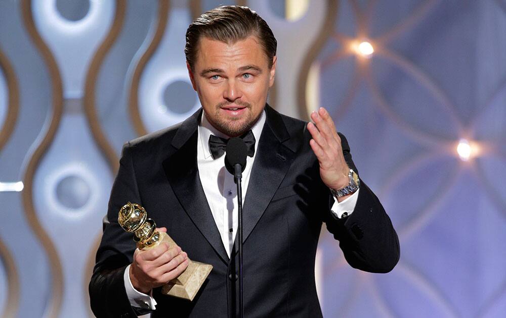 Leonardo DiCaprio accepting the award for best actor in a motion picture comedy for his role in `The Wolf of Wall Street` during the 71st annual Golden Globe Awards.
