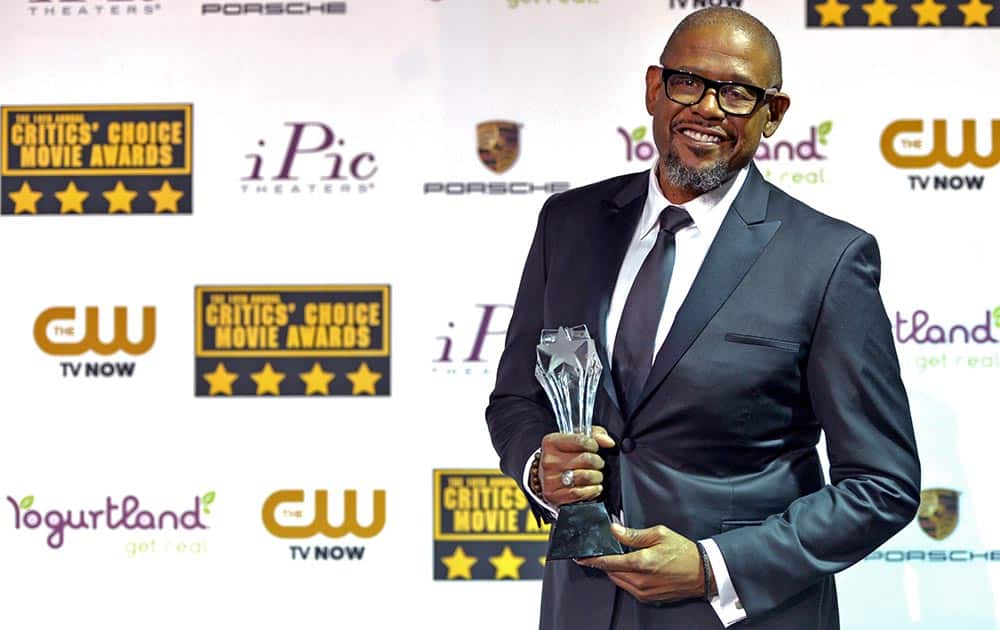 Forest Whitaker poses with the Joel Siegel Award in the press room at the 19th annual Critics' Choice Movie Awards at the Barker Hangar, in Santa Monica, Calif.