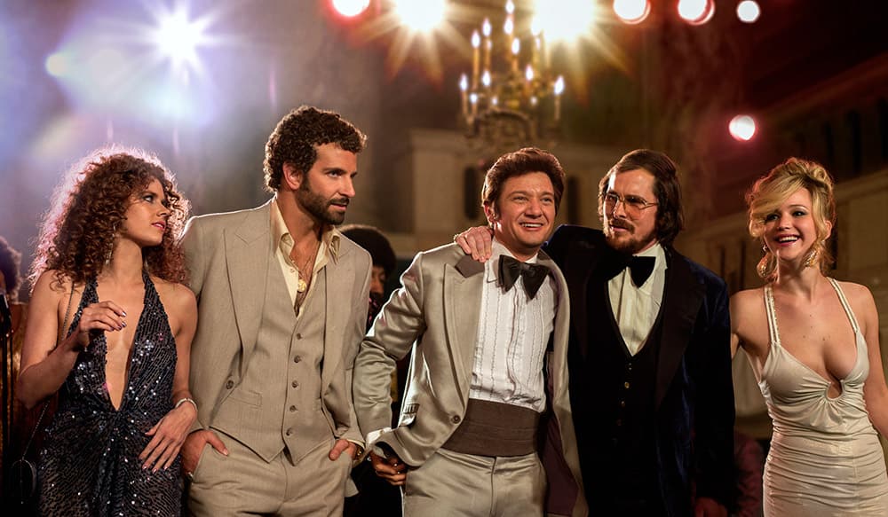 This film image released by Sony Pictures shows, Amy Adams, Bradley Cooper, Jeremy Renner, Christian Bale and Jennifer Lawrence in a scene from 'American Hustle.'