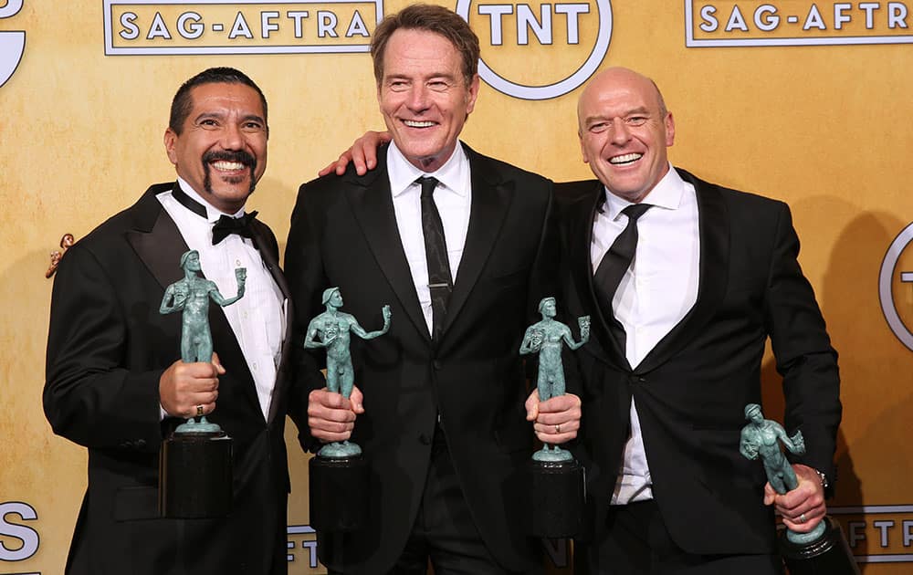 From Left, Steven Michael Quezada, Bryan Cranston and Dean Norris pose in the press room with their awards for outstanding performance by an ensemble in a drama series for `Breaking Bad` at the 20th annual Screen Actors Guild Awards at the Shrine Auditorium.