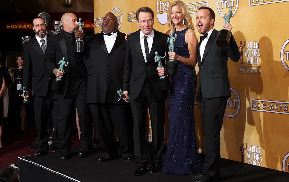 The cast of `Breaking Bad` from left, Patrick Sane, Matthew T. Metzler, Lavell Crawford, Bryan Cranston, Anna Gunn and Aaron Paul, pose in the press room with their awards for outstanding performance by an ensemble in a drama series for `Breaking Bad` at the 20th annual Screen Actors Guild Awards.