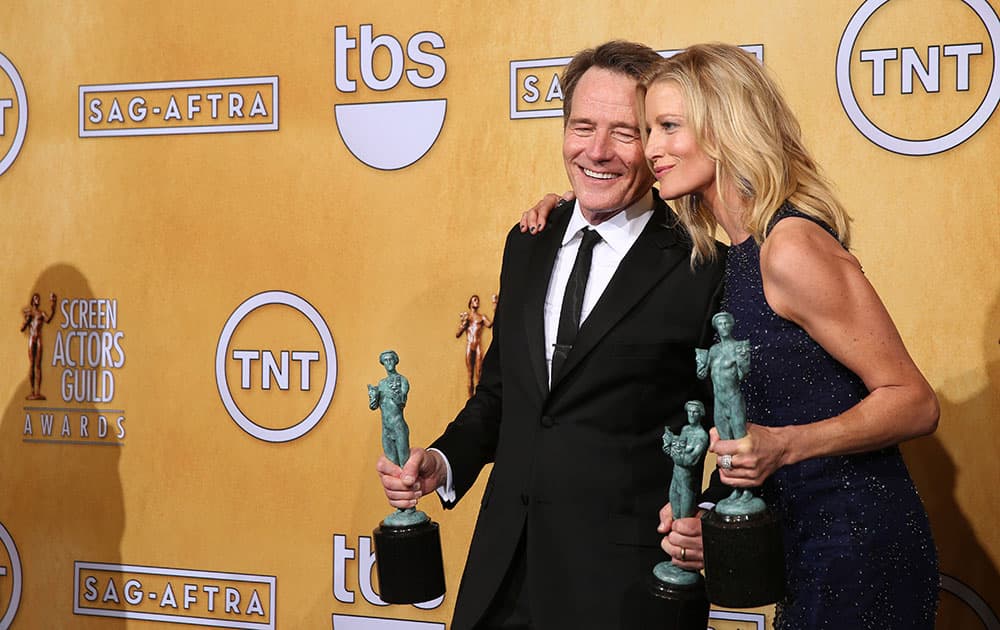 Bryan Cranston and Anna Gunn pose in the press room with their awards for outstanding performance by an ensemble in a drama series for `Breaking Bad` at the 20th annual Screen Actors Guild Awards at the Shrine Auditorium.