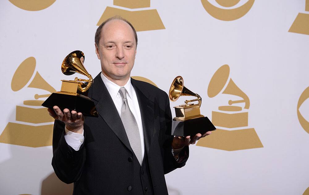 David Frost poses in the press room with the award for producer of the year - classical and best engineered album - classical for `Winter Morning Walks` at the 56th annual GRAMMY Awards.