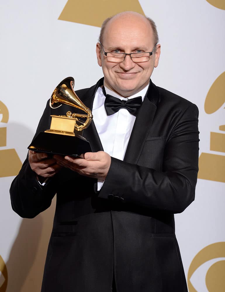 Wlodzimierz Pawlik poses in the press room with the award for best large jazz ensemble album for `Night In Calisia` at the 56th annual Grammy Awards.